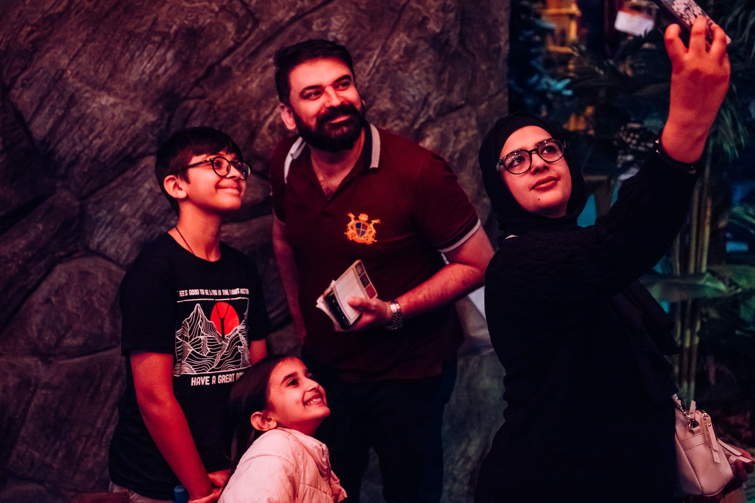 A family posing for a selfie.