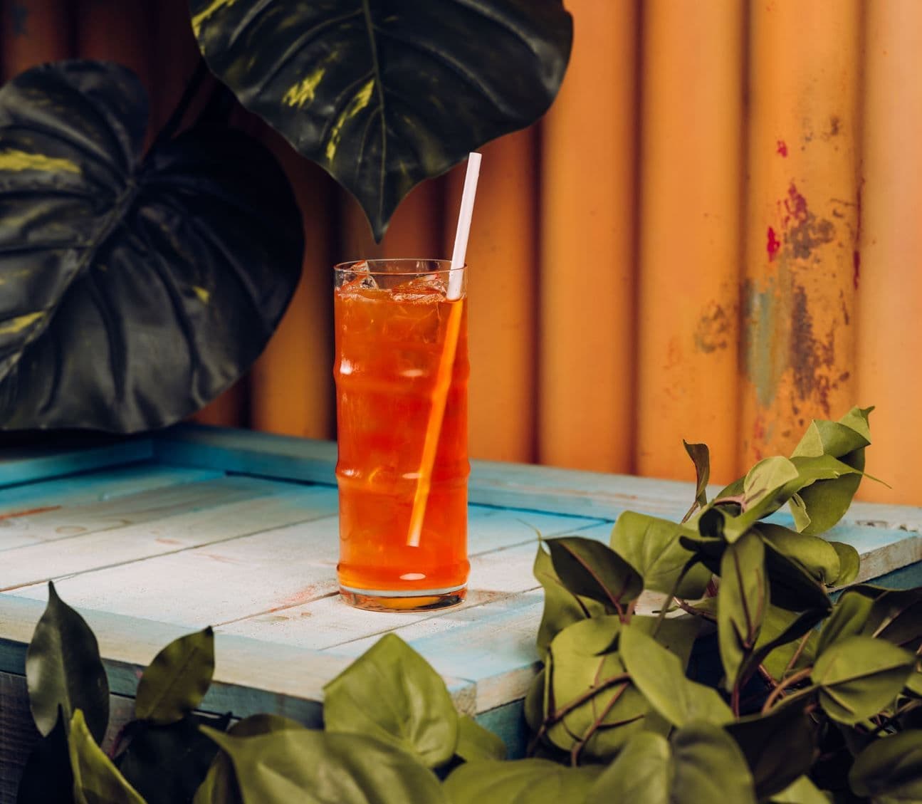 A peach iced tea displayed on a table at Treetop Golf.