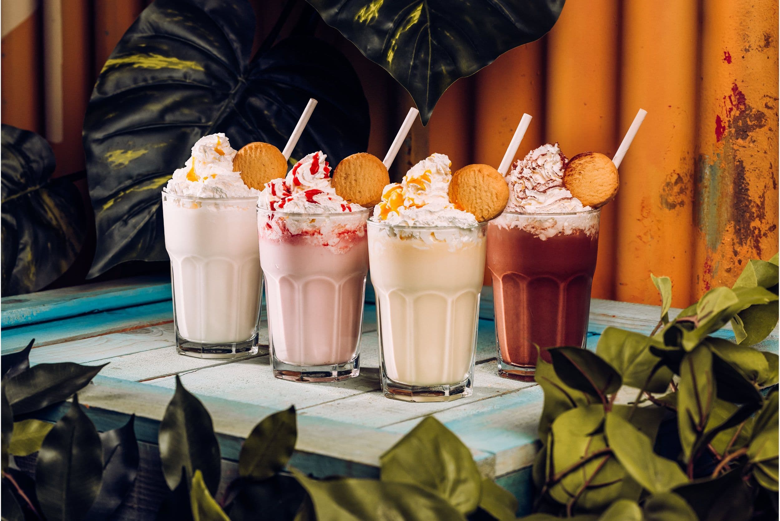 Treetop milkshakes lined up on a counter.