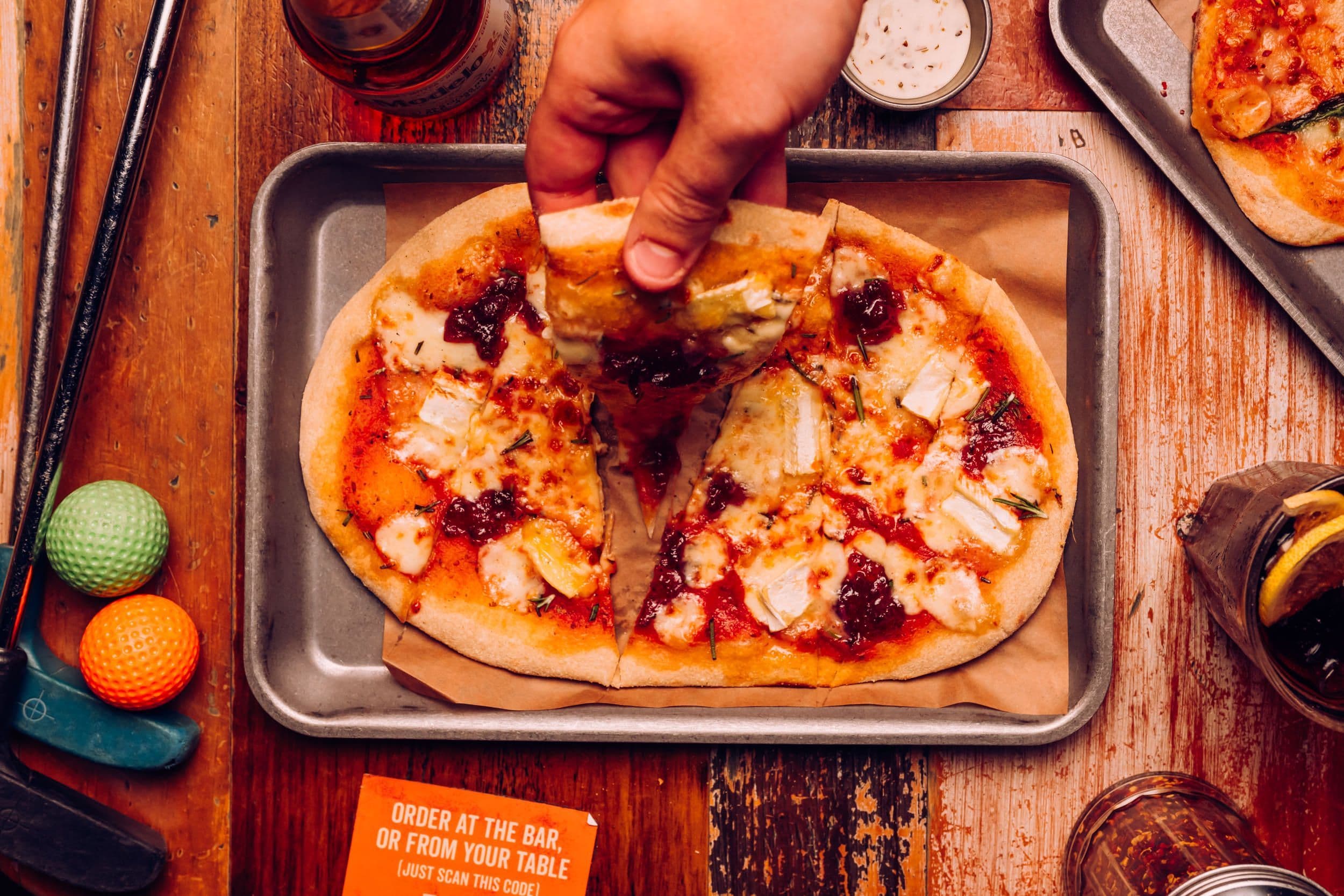 A slide being taken from the Cracking Cranbrie festive pizza.